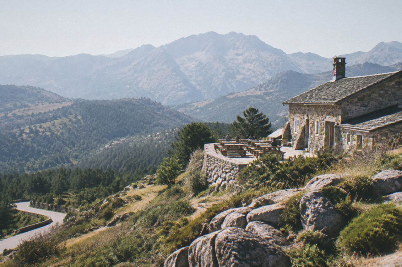 A stone mountain refuge on a granite ridge high above the Corsican maquis