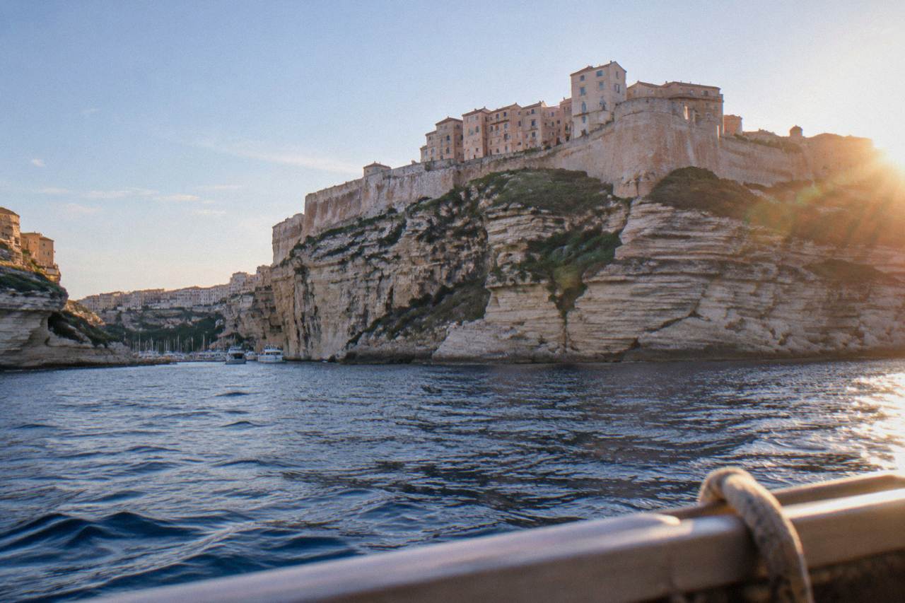 The limestone cliffs and fortified upper town of Bonifacio seen from the sea at Corsica's southern tip
