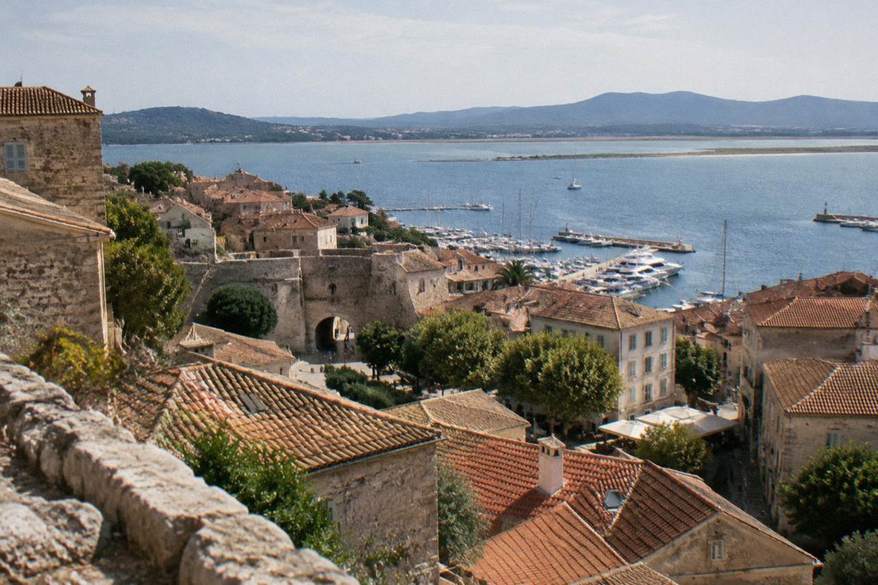 A view over the rooftops of Porto-Vecchio old town towards the sea and hills