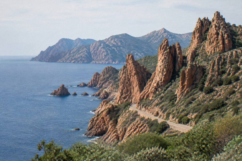 Red granite rock formations of the Calanques de Piana above the sea