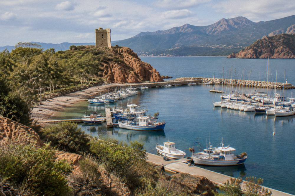 Fishing boats and moored sailing yachts in the marina at Porto Vecchio