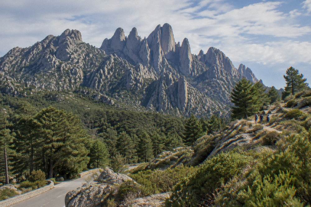 Granite peaks of the Aiguilles de Bavella rising above pine forest in southern Corsica