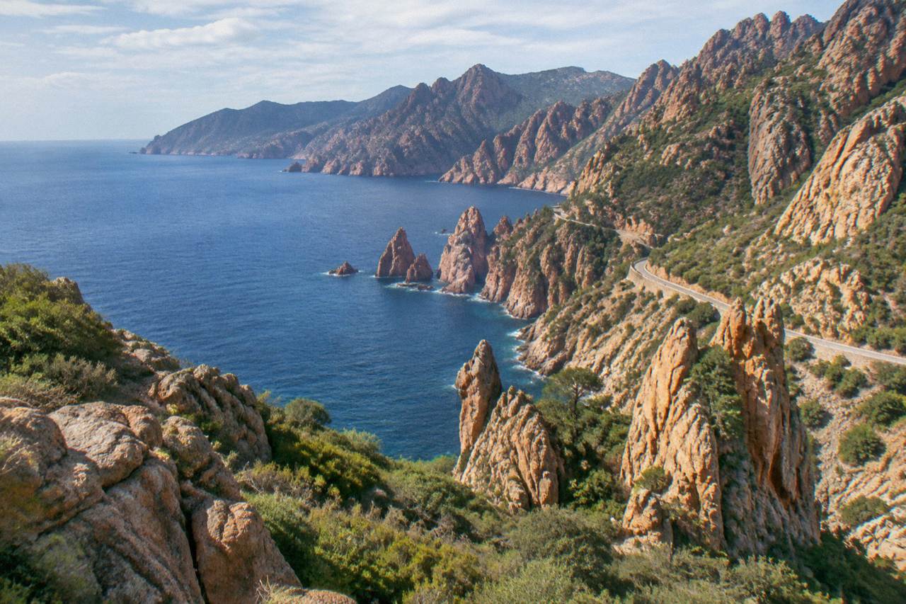 Rocky cliffs of the Calanques de Piana rising above the sea on the west coast of Corsica