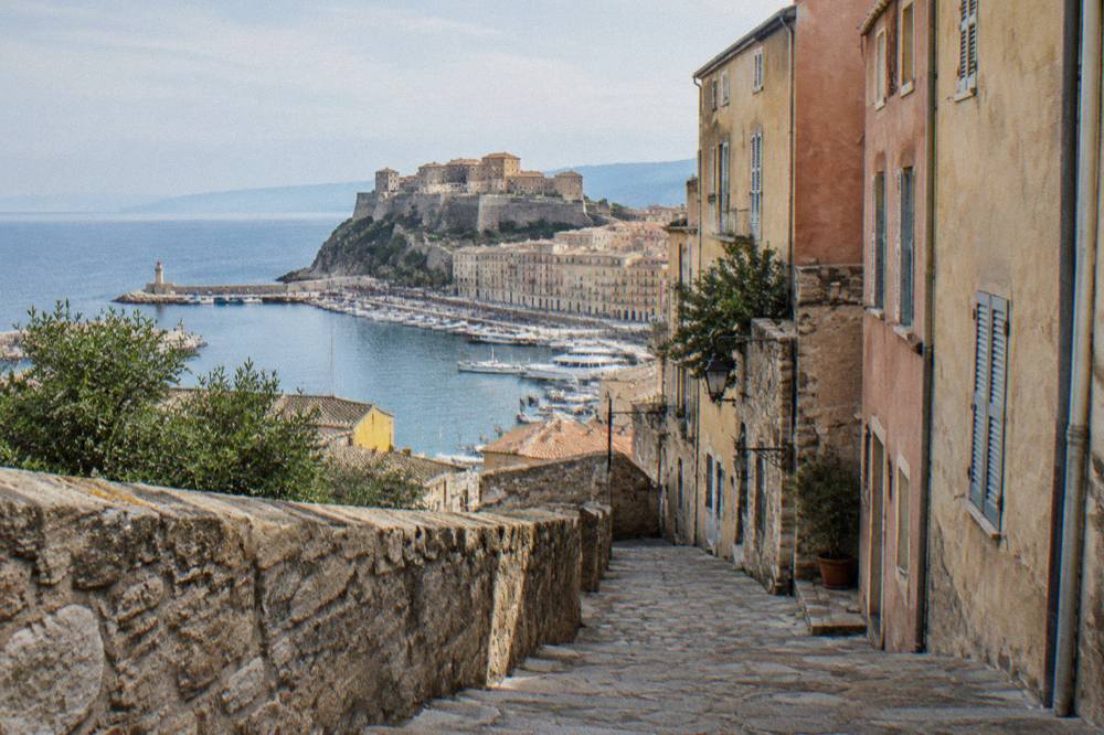 Narrow lane inside the citadel quarter of Bastia with old stone walls