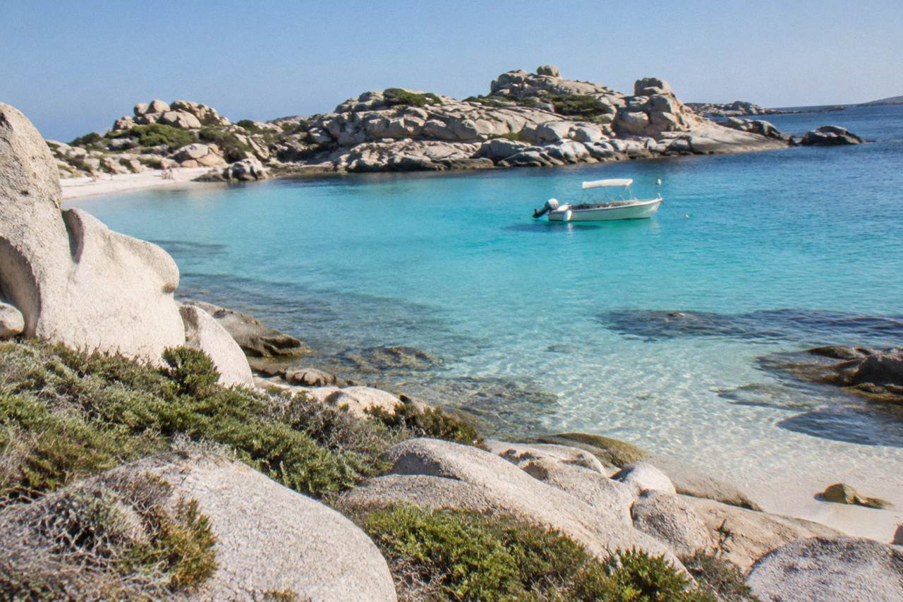 Granite rocks and clear shallow water at a small cove on the Lavezzi islands near Bonifacio