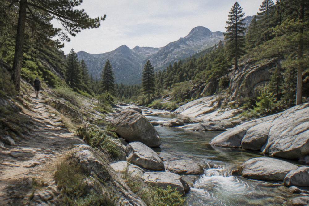 Water flowing between granite boulders in a Corsican river bed