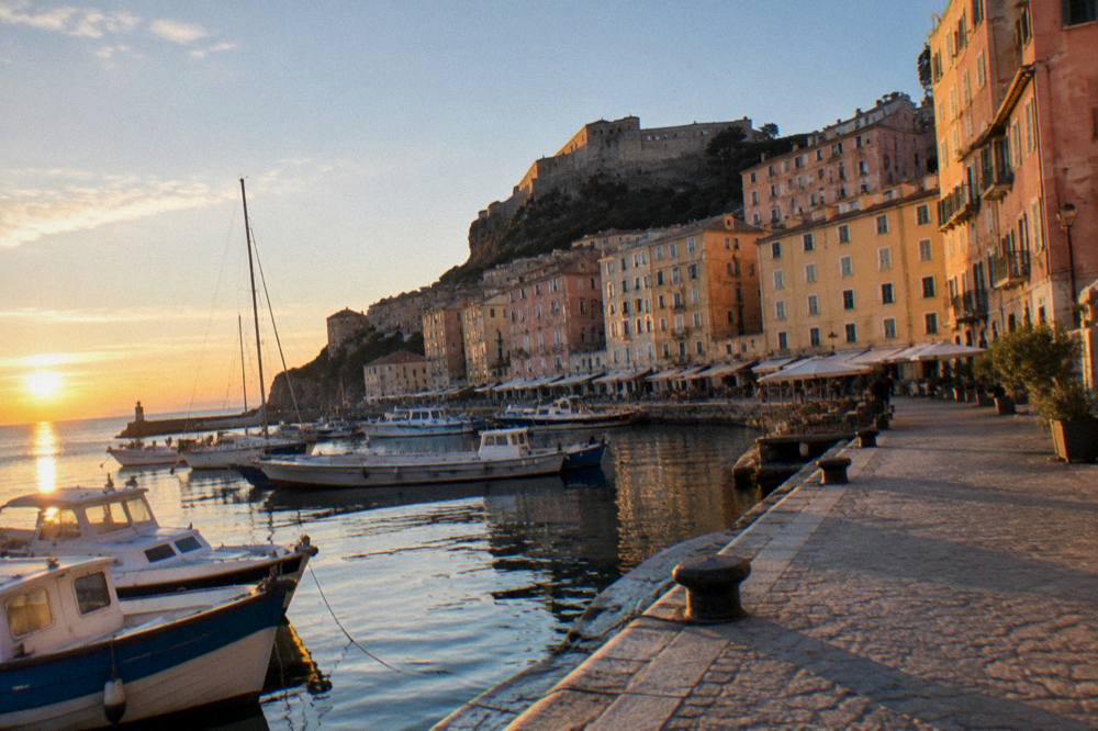 Evening light on the quayside and buildings of the old port in Bastia, Corsica