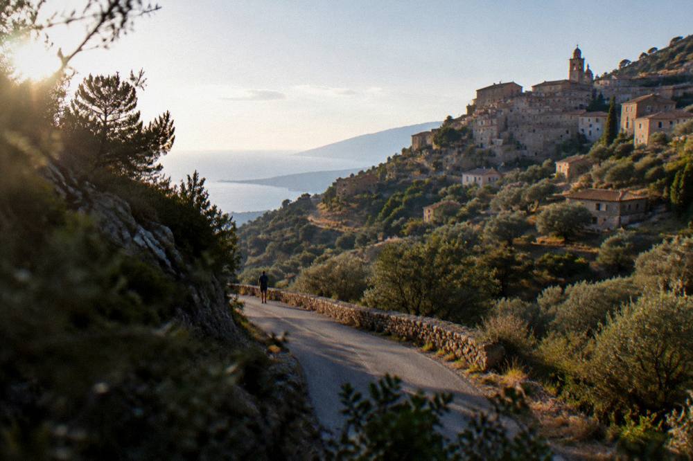 A country road winding through hills and maquis in the Balagne region of Corsica