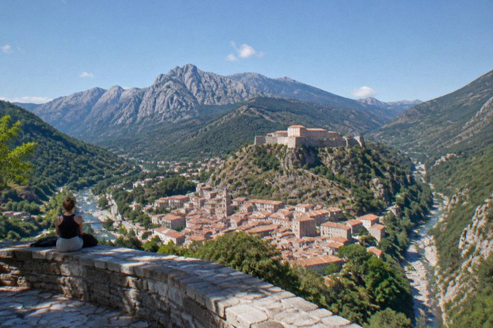 The belvedere above Corte looking down on red rooftops and two river gorges