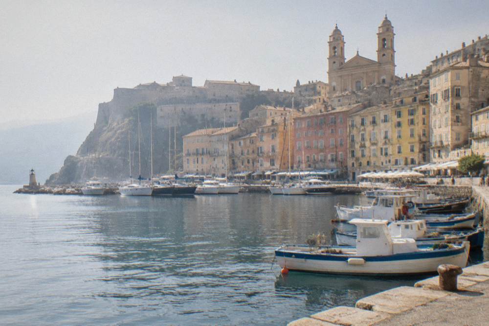 The old harbour of Bastia with its citadel buildings above the quay