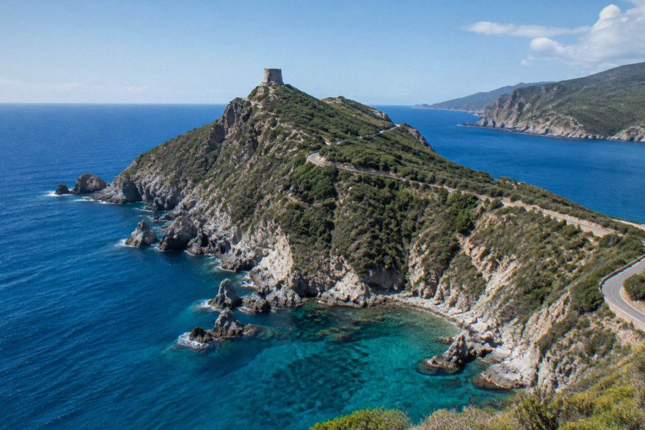 Aerial view of the Corsican coastline with turquoise water and rocky cliffs