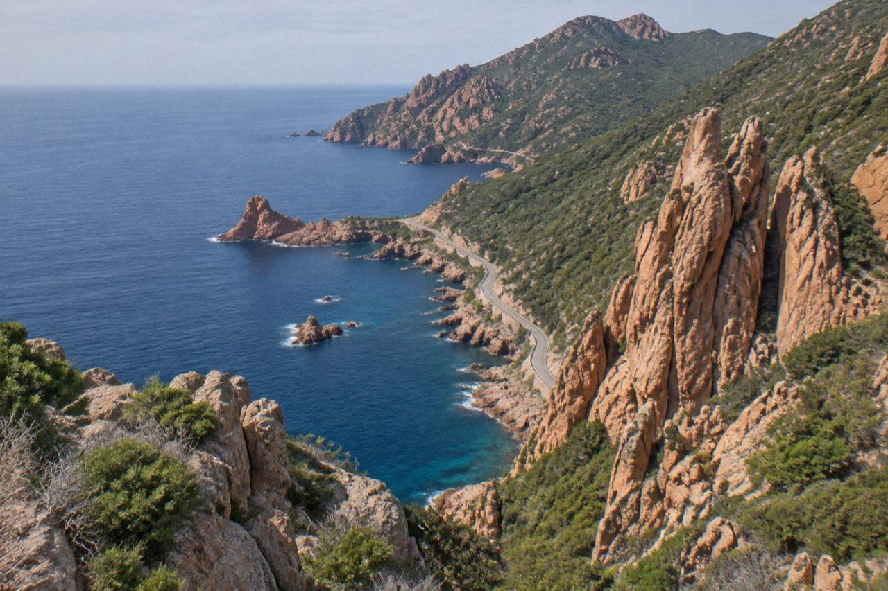 Red granite cliffs above the sea at the Calanques de Piana in Corsica