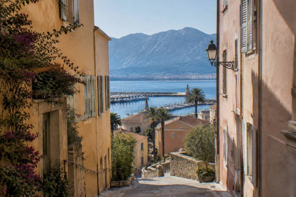 Pastel-toned houses and a narrow street in the old town of Ajaccio