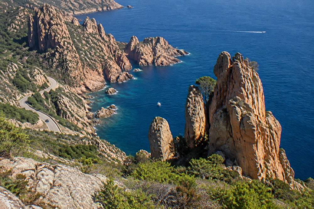 Red granite rock formations of the Calanques de Piana above the sea