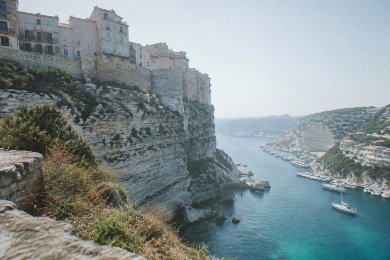 Granite cliffs and turquoise water along the Corsican coast near Bonifacio