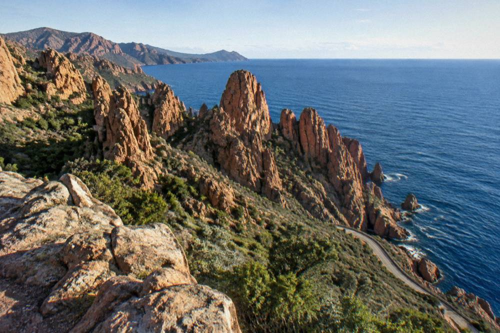 Red granite rock formations of the Calanques de Piana above the sea