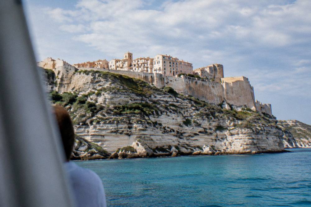 The cliffside town of Bonifacio seen from the sea with its citadel walls