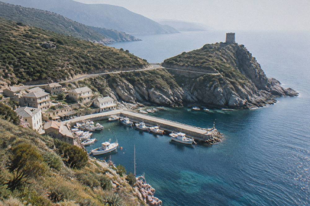 Fishing boats moored in a small harbour on the Cap Corse peninsula