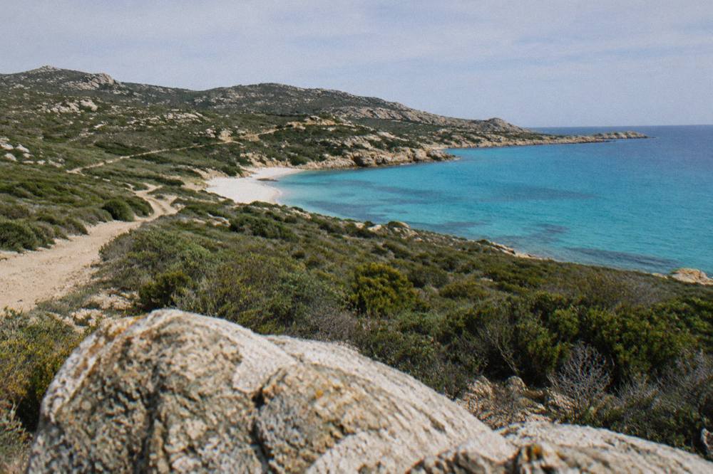 A white sand beach and turquoise water in the Désert des Agriates