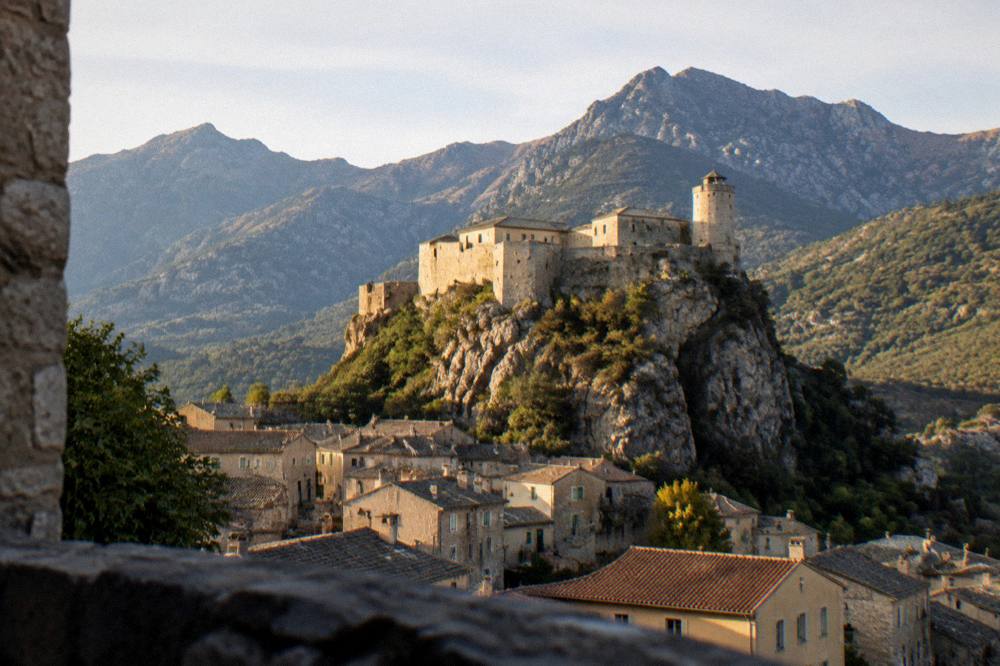 The citadel of Corte above the town in evening light