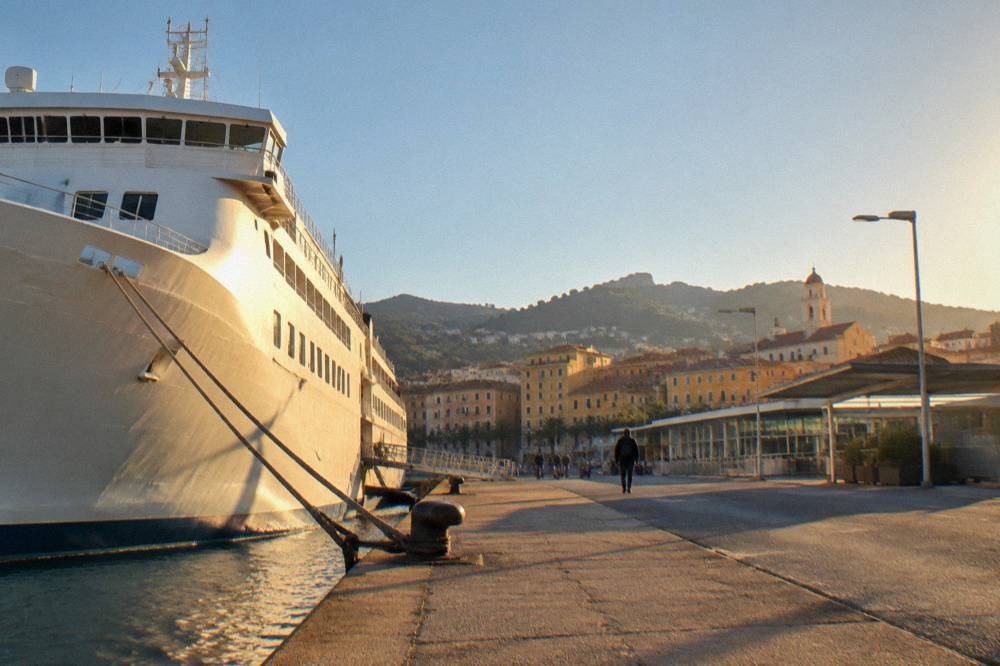 A ferry docked at a Corsican port in early morning light