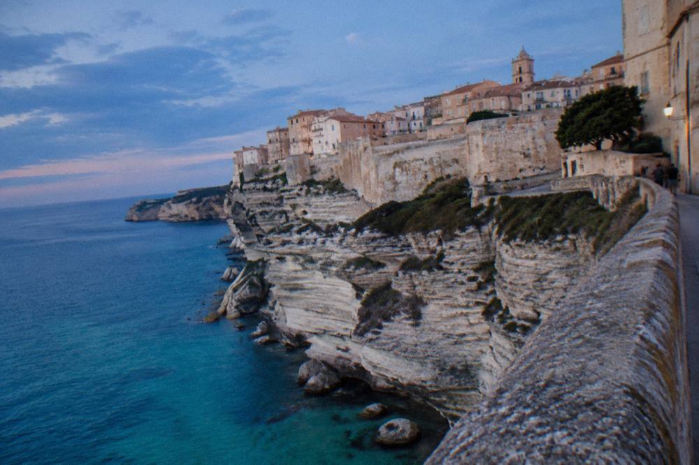 The Bonifacio citadel standing on white limestone cliffs above the sea