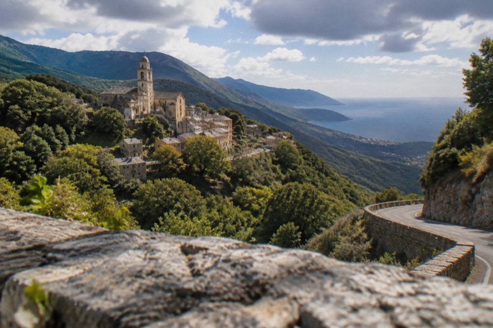 A winding mountain road above the sea on Corsica's west coast