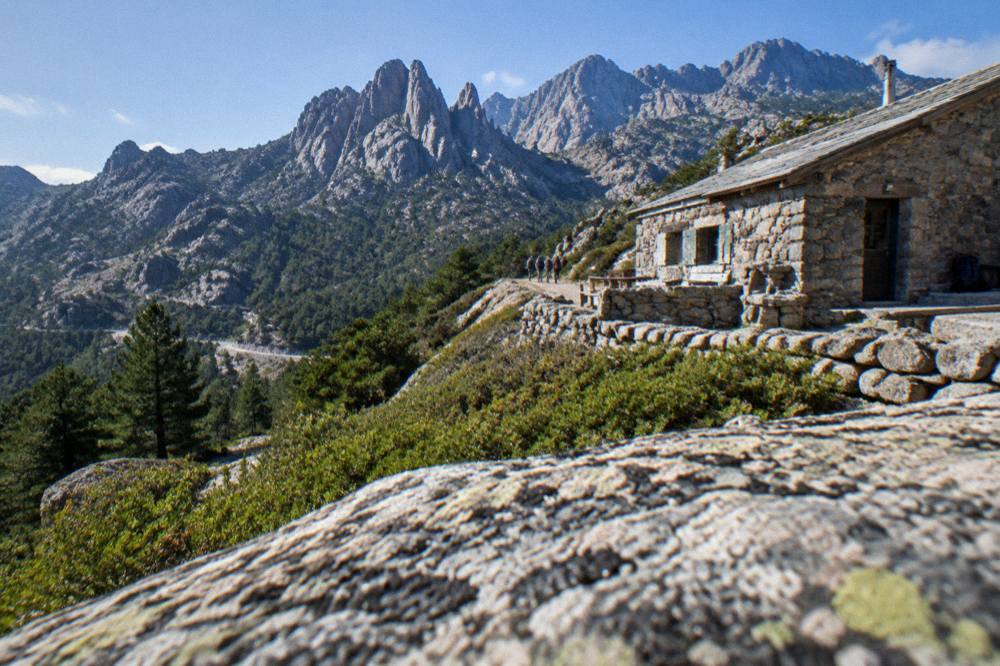 A stone refuge on a high Corsican mountain trail above the treeline