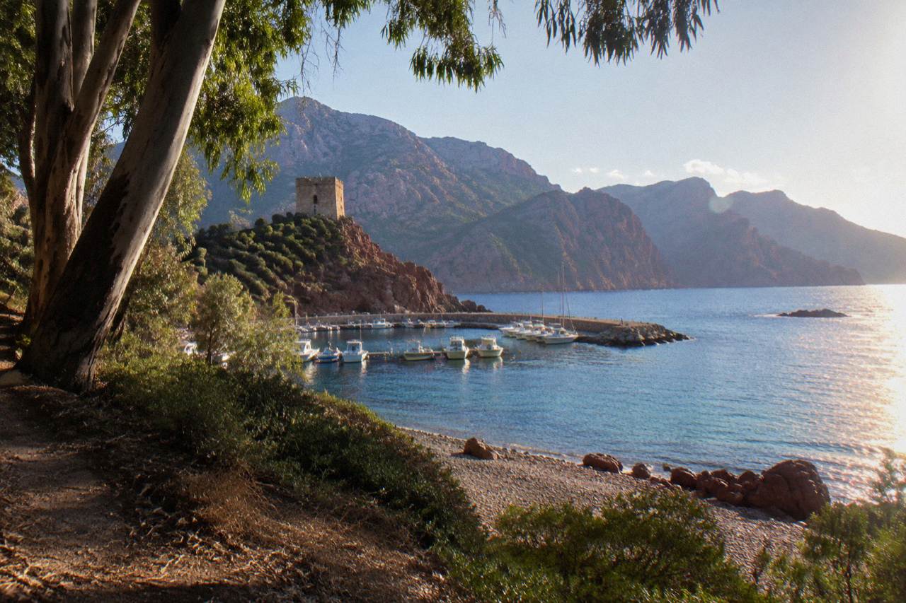 View over the red granite cliffs and blue sea of the Gulf of Porto in Corsica