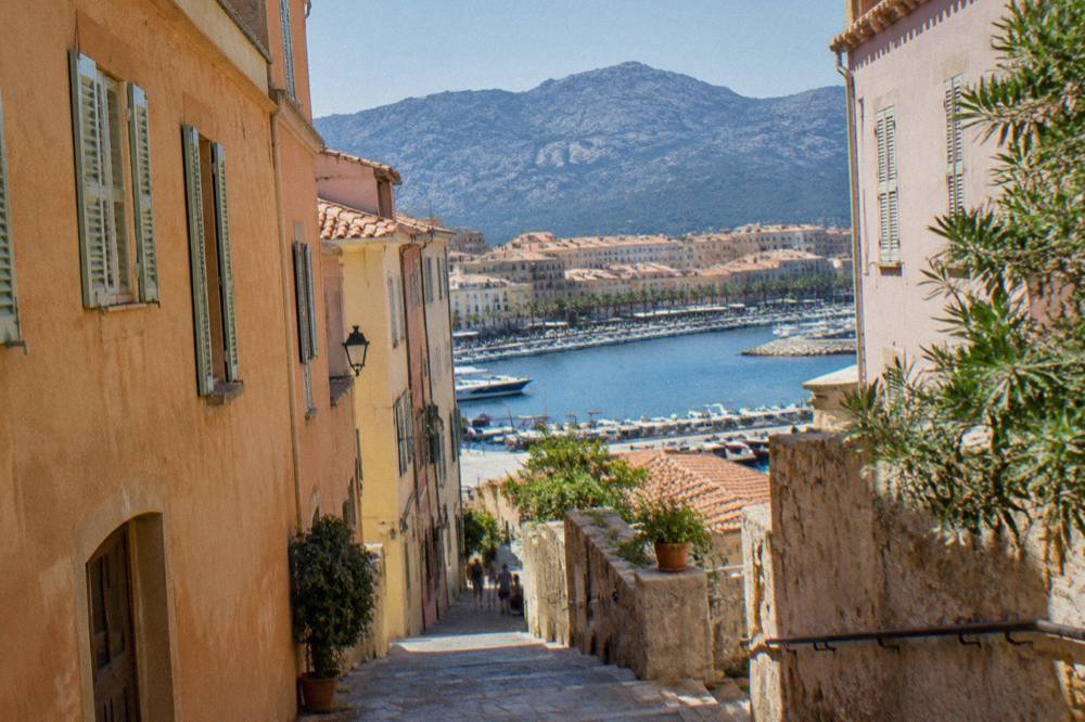 Pastel-toned houses and a narrow street in the old quarter of Ajaccio