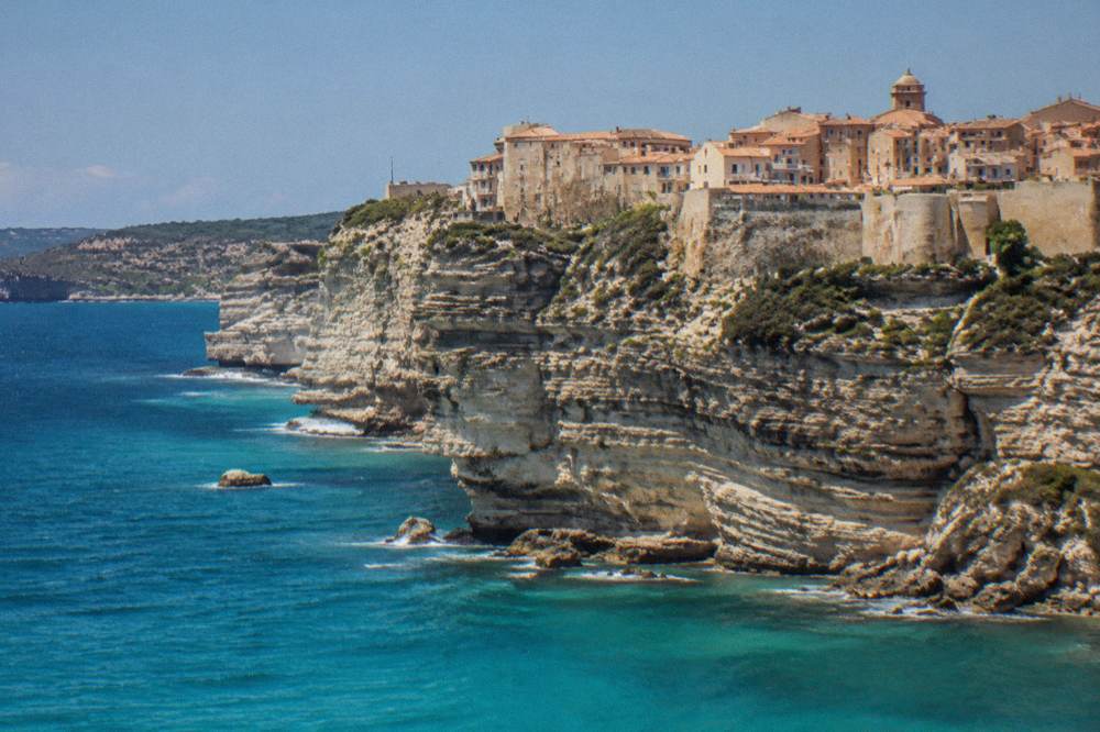 White limestone cliffs and the upper town of Bonifacio above the sea