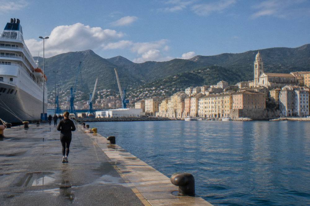 The old port of Bastia seen from the sea with its tall houses and church tower